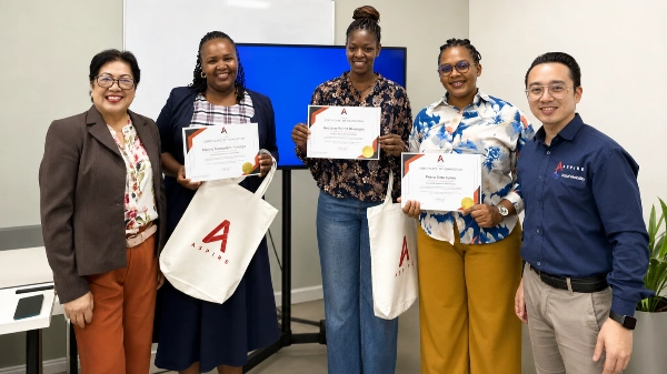 Students holding up certificates 1 1