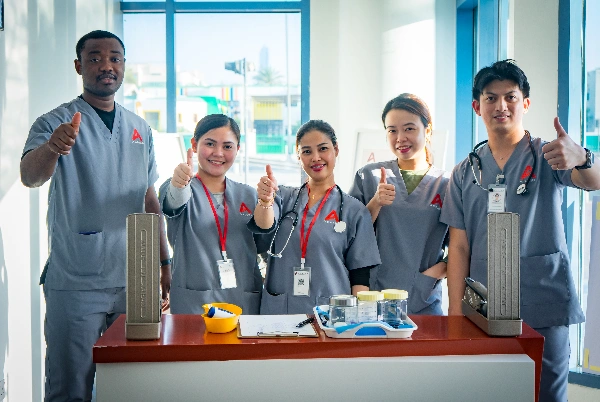 group of nursing students are standing with smiling faces